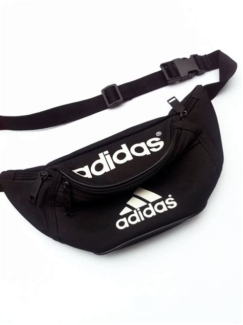 the iconic trefoil logo on the webbed shoulder strap is a nod to adidas sport heritage. . Fanny pack adidas